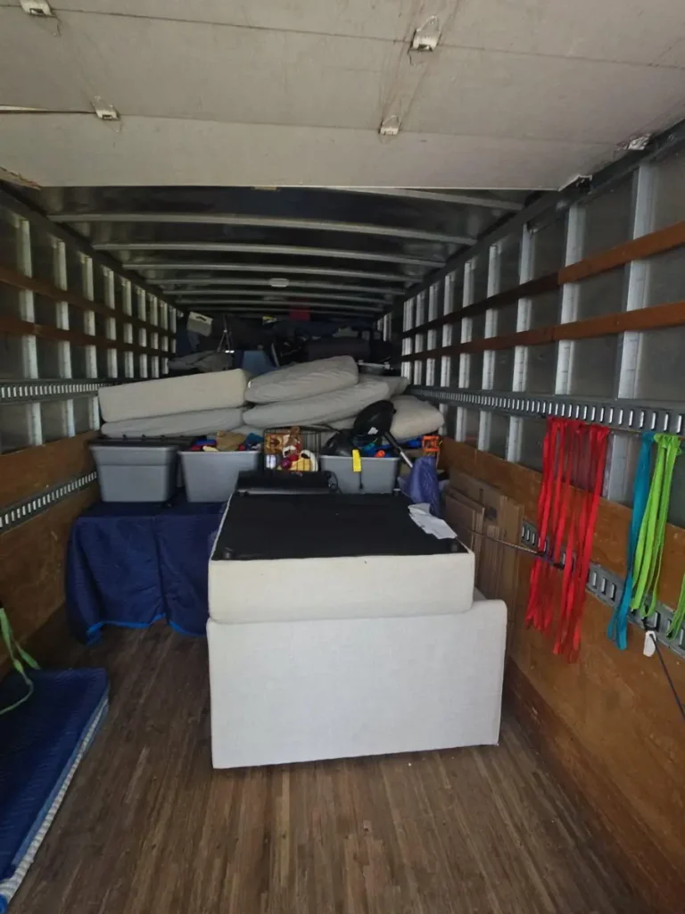 Wrapped furniture and boxes loaded in a moving truck