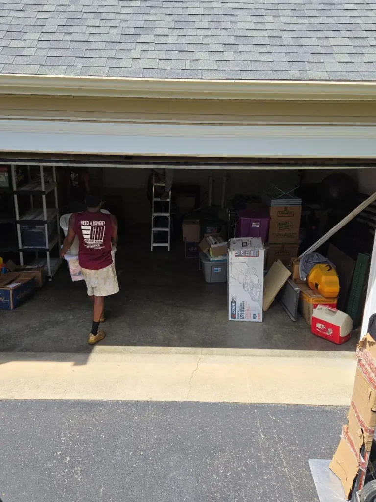 Collegiate Movers crew member working on a garage move