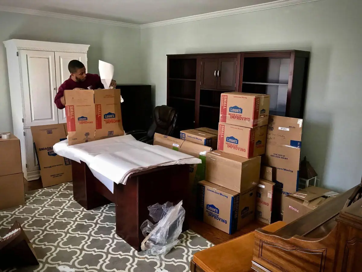 Movers in Cave Spring VA packing a home office